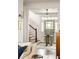 Open Entryway features a light green front door, beautiful floors, and a staircase at 1602 Windsor Walk, Avondale Estates, GA 30002