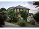 Inviting two-story home with a charming front porch and well-maintained landscaping at 1602 Windsor Walk, Avondale Estates, GA 30002