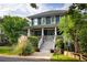 Beautiful two-story home featuring a welcoming front porch and professionally landscaped front yard at 1602 Windsor Walk, Avondale Estates, GA 30002