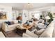 Open-concept living room with hardwood floors and bright natural light at 1602 Windsor Walk, Avondale Estates, GA 30002