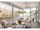 Screened porch with outdoor seating, ceiling fan, and views of the backyard at 1602 Windsor Walk, Avondale Estates, GA 30002