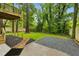 Spacious backyard with lush green lawn and patio area featuring stylish rock beds at 2760 Fraser Se St, Smyrna, GA 30080