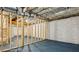 Unfinished basement with exposed ceiling and blue painted concrete floor at 2760 Fraser Se St, Smyrna, GA 30080