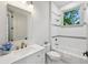 Elegant bathroom featuring white tile, a shower, and modern fixtures at 2760 Fraser Se St, Smyrna, GA 30080
