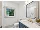 Modern bathroom with stylish vanity, mirror, and fixtures at 2760 Fraser Se St, Smyrna, GA 30080