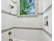 Bright bathroom featuring white tile, a shower, and modern fixtures at 2760 Fraser Se St, Smyrna, GA 30080