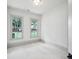 Bright bedroom with neutral walls and two large windows providing natural light at 2760 Fraser Se St, Smyrna, GA 30080