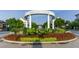 Entry to Smyrna Market Village with manicured landscaping and vibrant flowers at 2760 Fraser Se St, Smyrna, GA 30080