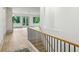 Bright entryway featuring hardwood floors, a staircase with black metal railing, and lots of natural light at 2760 Fraser Se St, Smyrna, GA 30080