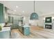 Living area with hardwood floors, a kitchen and fireplace, and bright natural light at 2760 Fraser Se St, Smyrna, GA 30080