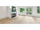 Spacious living room featuring a fireplace and French doors leading to a balcony at 2760 Fraser Se St, Smyrna, GA 30080
