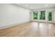 Spacious living room featuring hardwood floors and large windows bringing in natural light at 2760 Fraser Se St, Smyrna, GA 30080