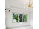 Bright living room featuring large windows and a modern chandelier at 2760 Fraser Se St, Smyrna, GA 30080