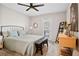 Comfortable bedroom with outdoor access, light-colored carpet, and modern ceiling fan at 406 Country Park Se Dr, Smyrna, GA 30080