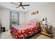 Cozy bedroom featuring bright natural light, modern ceiling fan, and comfortable decor at 406 Country Park Se Dr, Smyrna, GA 30080