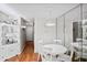 Charming dining area with a white table, chairs, and a mirrored wall feature at 406 Country Park Se Dr, Smyrna, GA 30080