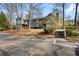 Inviting exterior of a gray two-story home with balconies and a landscaped entrance at 406 Country Park Se Dr, Smyrna, GA 30080