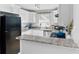 Well-equipped kitchen with granite countertops, white cabinets, and stainless steel appliances at 406 Country Park Se Dr, Smyrna, GA 30080