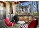 Relaxing patio space with outdoor seating and wooded views at 406 Country Park Se Dr, Smyrna, GA 30080