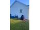 Exterior view of the side of the home showing white vinyl siding at 10600 Pine Forest Ln, Jonesboro, GA 30238