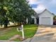 Inviting single-Gathering home featuring a well-kept lawn and attached garage at 10600 Pine Forest Ln, Jonesboro, GA 30238