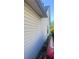 Exterior view of the side of the home showing white vinyl siding at 10600 Pine Forest Ln, Jonesboro, GA 30238