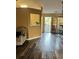 Living room features a view of the backyard and dark, stained, wood floors at 10600 Pine Forest Ln, Jonesboro, GA 30238