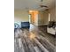 Spacious living room with vaulted ceilings, ceiling fan, and wood-look floors at 10600 Pine Forest Ln, Jonesboro, GA 30238