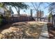 Wide backyard with privacy fence and stone pathway at 18 Polo Ne Dr, Atlanta, GA 30309