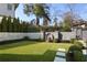 Well-manicured backyard featuring a stone wall with fountain and lush landscaping at 18 Polo Ne Dr, Atlanta, GA 30309
