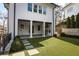 Charming backyard with an outdoor kitchen and landscaped garden at 18 Polo Ne Dr, Atlanta, GA 30309