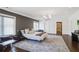 Spacious main bedroom boasts hardwood floors, large windows, and modern lighting at 18 Polo Ne Dr, Atlanta, GA 30309