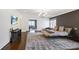 Spacious main bedroom boasts hardwood floors, large windows, and modern lighting at 18 Polo Ne Dr, Atlanta, GA 30309