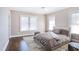 Comfortable bedroom with windows, a bed, and neutral tones at 18 Polo Ne Dr, Atlanta, GA 30309