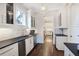 Convenient butler's pantry with sleek countertops, cabinets, and a wine fridge for entertaining guests at 18 Polo Ne Dr, Atlanta, GA 30309