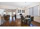 Cozy dining area with a modern chandelier, stylish seating, and a view into the living room at 18 Polo Ne Dr, Atlanta, GA 30309