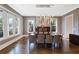 Formal dining room with modern chandelier, hardwood floors, and natural light from large windows at 18 Polo Ne Dr, Atlanta, GA 30309