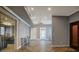 Elegant entryway with herringbone floors, neutral walls, and glass doors to an adjacent room at 18 Polo Ne Dr, Atlanta, GA 30309