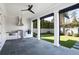Covered outdoor kitchen with stainless steel appliances and a view of the landscaped backyard at 18 Polo Ne Dr, Atlanta, GA 30309