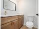 Updated bathroom with wood vanity, solid surface counter and modern fixtures at 657 Stratford Green Way, Avondale Estates, GA 30002