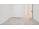 This bedroom has plush carpet and a large closet at 657 Stratford Green Way, Avondale Estates, GA 30002
