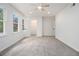 Bright, spacious bedroom with plush carpet, multiple windows, and closet at 657 Stratford Green Way, Avondale Estates, GA 30002
