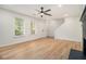 Bright living room with luxury vinyl plank flooring, a ceiling fan, and lots of natural light at 657 Stratford Green Way, Avondale Estates, GA 30002