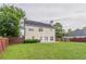 Great backyard space, with mature trees, a privacy fence and a grass lawn at 806 Chelsea Wood Ct, Stockbridge, GA 30281