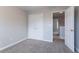 Bedroom featuring neutral walls, carpeted floor, and a view to the hallway at 806 Chelsea Wood Ct, Stockbridge, GA 30281