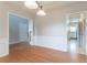 Open concept dining area with hardwood floors and direct access to a modern kitchen at 806 Chelsea Wood Ct, Stockbridge, GA 30281