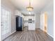 Cozy dining area connecting to a well-equipped kitchen, featuring hardwood floors and ample natural light at 806 Chelsea Wood Ct, Stockbridge, GA 30281