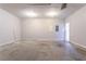 Spacious garage with concrete flooring, overhead lighting, and an access door at 806 Chelsea Wood Ct, Stockbridge, GA 30281