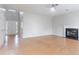 Bright and airy living room featuring a fireplace and hardwood floors, creating a warm and welcoming ambiance at 806 Chelsea Wood Ct, Stockbridge, GA 30281