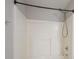 Clean shower with white tiling and a detachable shower head, offering a simple and functional space at 806 Chelsea Wood Ct, Stockbridge, GA 30281